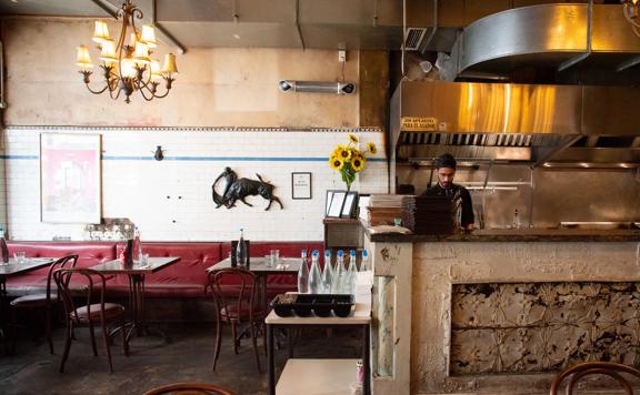 A staff member works in the open kitchen at El Matador.