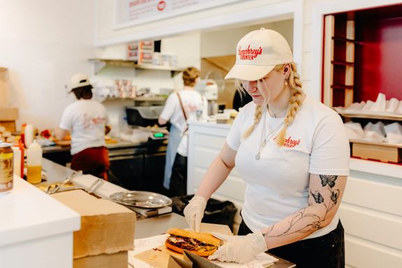 Staff member preparing a sandwich at Humphrey’s Counter in Wellington CBD.