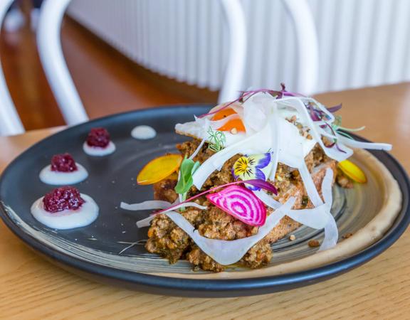 Close-up shot of a plate of food at Comes and Goes in Lower hutt.