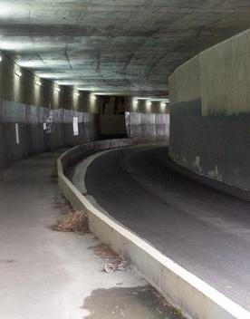 The urban setting of the Hutt Road Ngauranga Interchange, where highways got over tunnels with walls that once had graffiti.