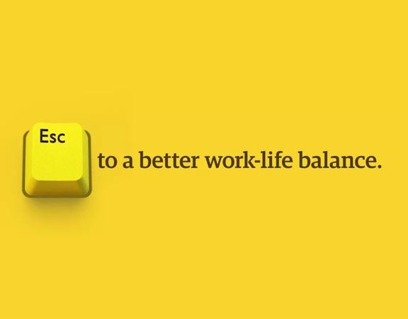 Keyboard ESC key on yellow background with "to a better work-life balance" written next to it.