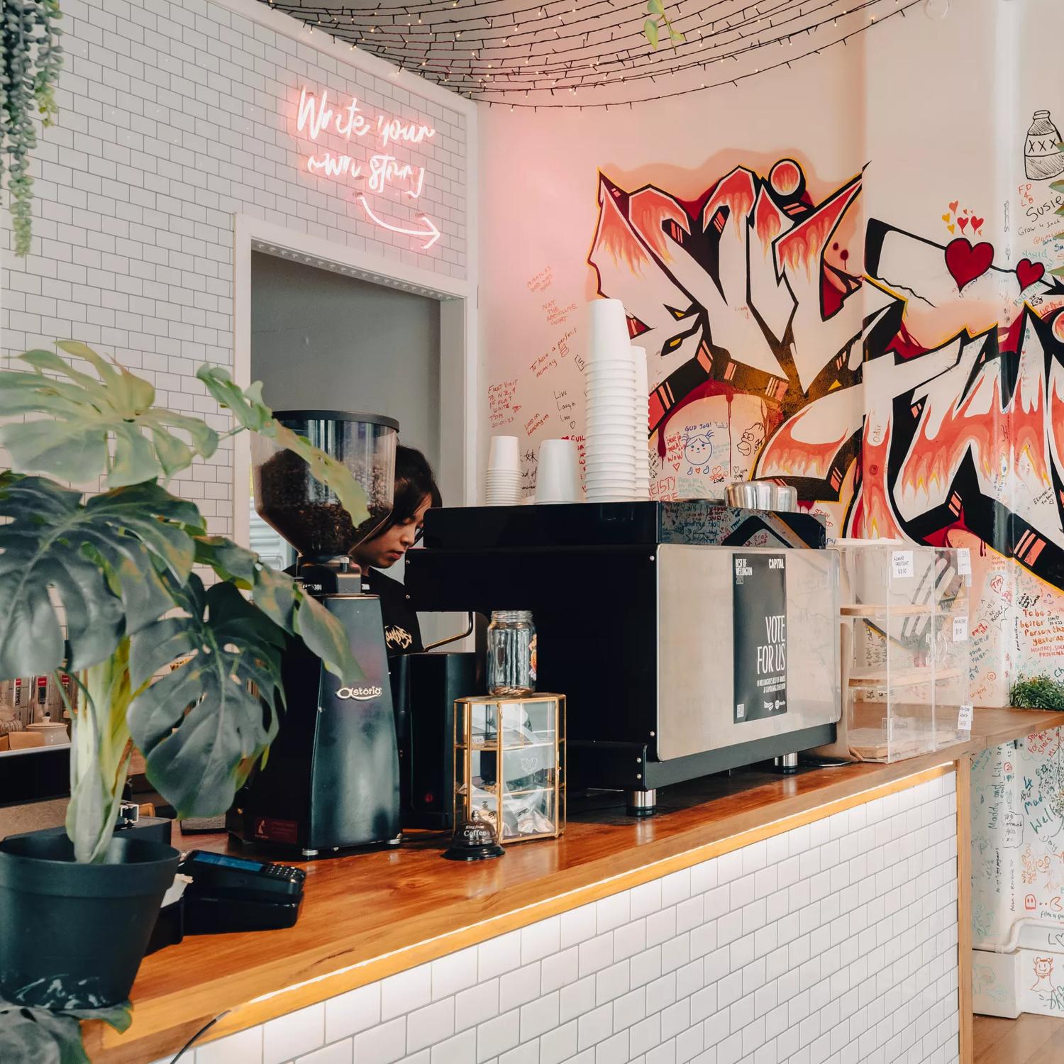 Interior of Evil Twins, focused on the graffiti wall.