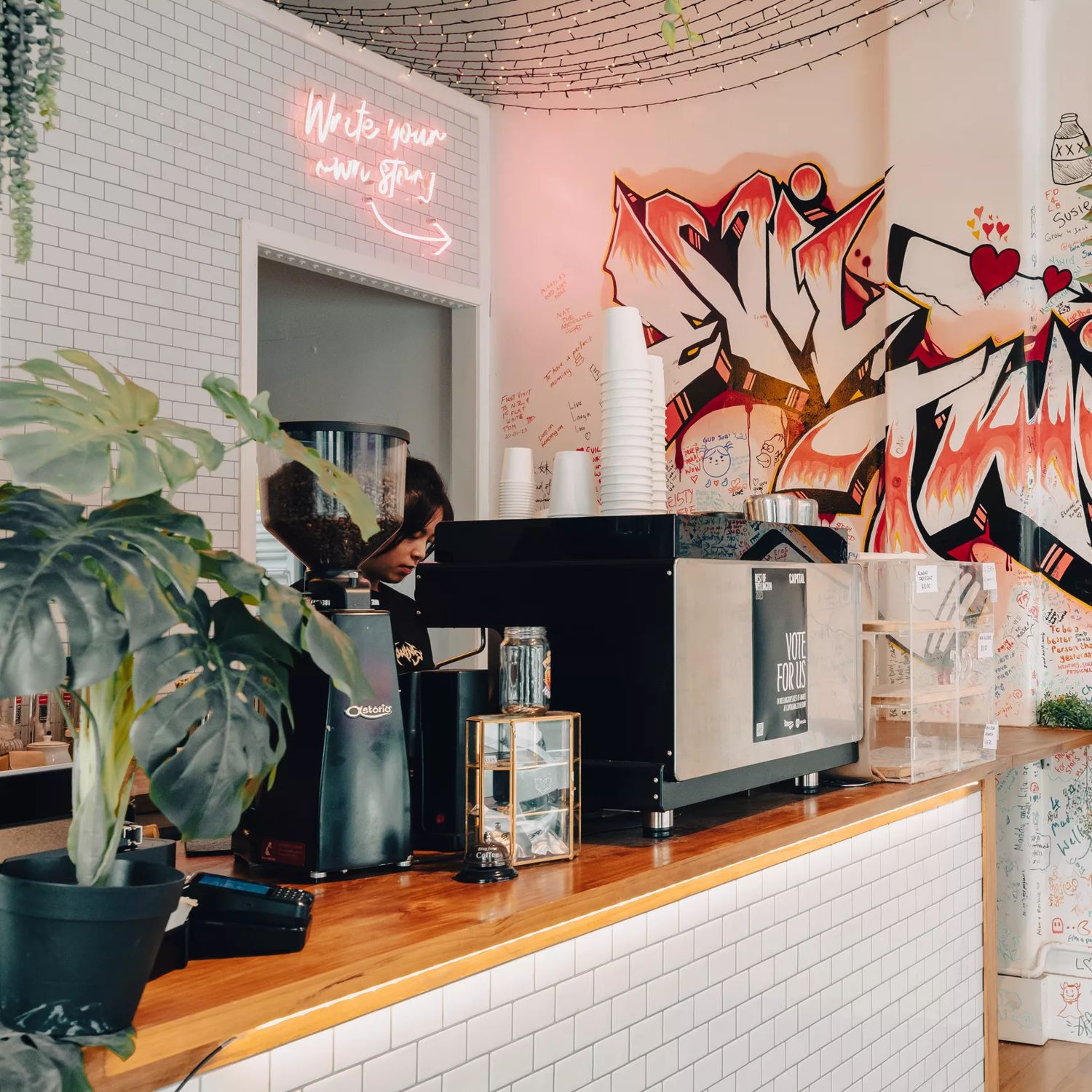Interior of Evil Twins, focused on the graffiti wall.