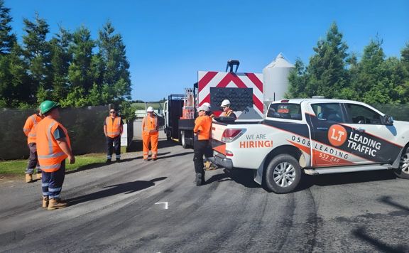 Roadworkers on a street before starting work