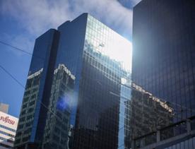 The mix of modern and old buildings along Lambton Quay, including the old supreme court, and old bank.