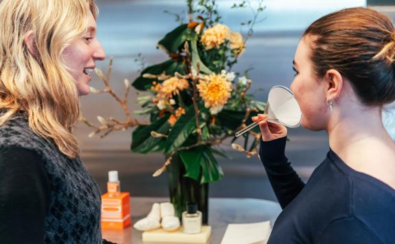 Two people sampling scents from the Abel Odor perfumery in Wellington.