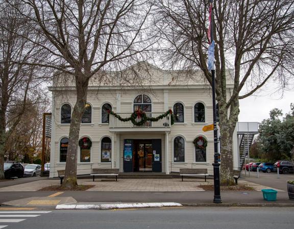 The screen location of Greytown, a historic small town featuring Victorian buildings,  stables, colonial cottages, and rural landscapes surrounding.