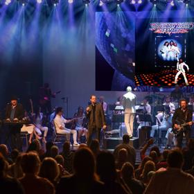 The Best of the Bee Gees Saturday Night Fever and the George Ellis Orchestra perform on stage with blue spotlights.