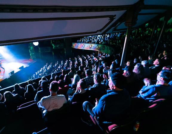 A packed audience watches the Best Foods Comedy Gala 2024 at The Opera House in Wellington. 