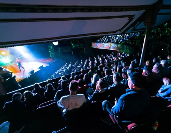 A packed audience watches the Best Foods Comedy Gala 2024 at The Opera House in Wellington.