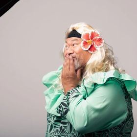 Comedian Tofiga Fepulea’i posing while dressed as one of his characters