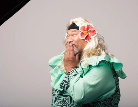 Comedian Tofiga Fepulea’i posing while dressed as one of his characters