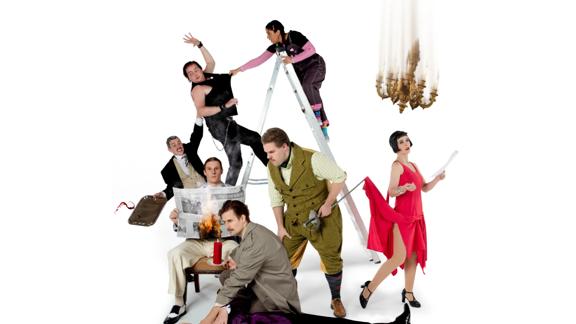 The characters from The Play That Goes Wrong stage a theatrical tableau.