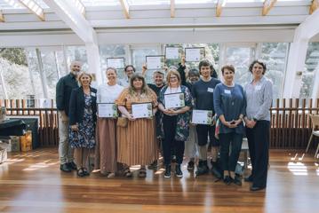 The team members of the Wellington Sustainable Tourism program holding their awards.