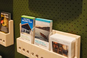 Brochures for Wellington tours sit in a wooden box at the isite.