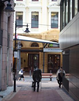 The mix of modern and old buildings along Lambton Quay, including the old supreme court, and old bank.