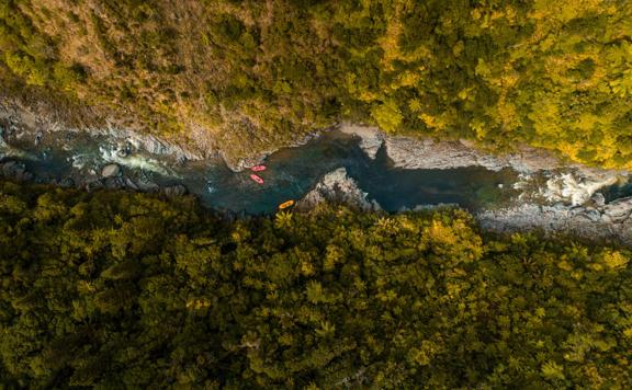 An aerial view of Te Awa Kairangi / Hutt River with three rafts from Wellington Rafting in Upper Hutt. 