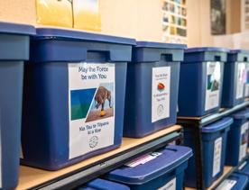 Blue boxes on the shelves at House of science, carrying tools for the lessons.