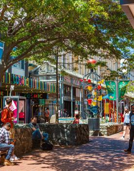 The colourful Bucket Fountain on bustling Cuba Street in Te Aro, Wellington on a sunny day. 
