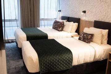 A twin single bed room inside Trinity Hotel Wellington.