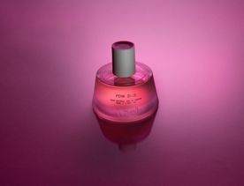 Pink Iris fragrance bottle from Abel on a hot pink background.