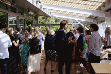 People mingling and enjoying nibbles at the award ceremony for the Wellington Sustainable Tourism programme.