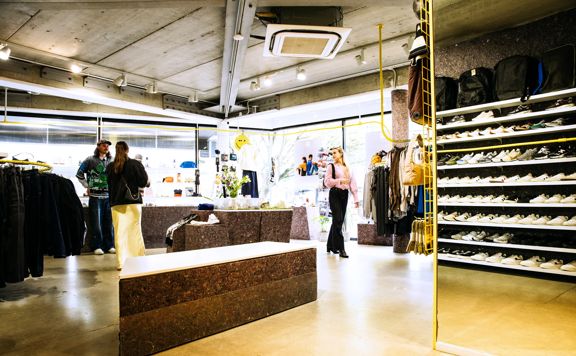 Three shoppers browsing inside Good As Gold, a streetwear store in Te Aro, Wellington.