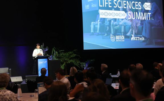 Zahra Champion speaking on stage at Life Sciences Summit 2025.