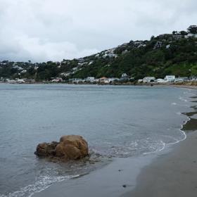 Worser Bay is a scenic inner-harbour beach popular with swimmers, dog walkers, and bridal couples. The large, sandy beach on the eastern side of Miramar Peninsula offers views of the Ororongorongo Range across the harbour, Steeple Rock, and Seatoun Beach.