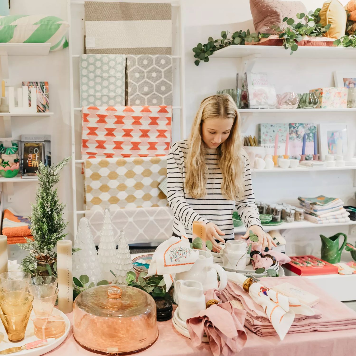 Staff inside the very pastel and vibrant Tea Pea gift and homeware store.