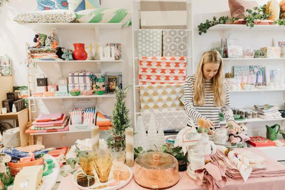 Staff inside the very pastel and vibrant Tea Pea gift and homeware store.