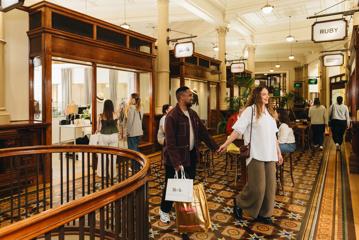 A young couple shopping at Old Bank Arcade in Wellington.
