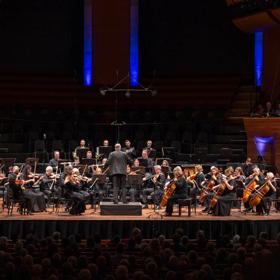 Orchestra Wellington performs on stage at the Michael Fowler Centre.