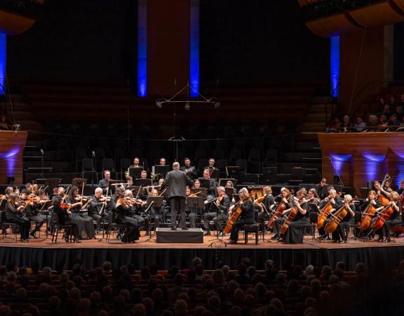 Orchestra Wellington performs on stage at the Michael Fowler Centre.