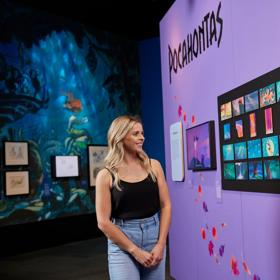 A person looks at the Pocahontas display at the Disney: the Magic of Animation exhibition.