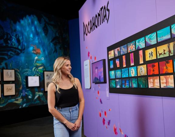 A person looks at the Pocahontas display at the Disney: the Magic of Animation exhibition.