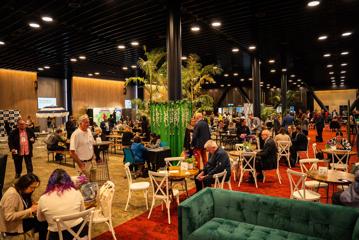 Delegates mingle in break out spaces at the New Zealand International Education Conference at Tākina.