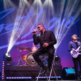 Fastlove, the George Michael tribute act performs on stage.