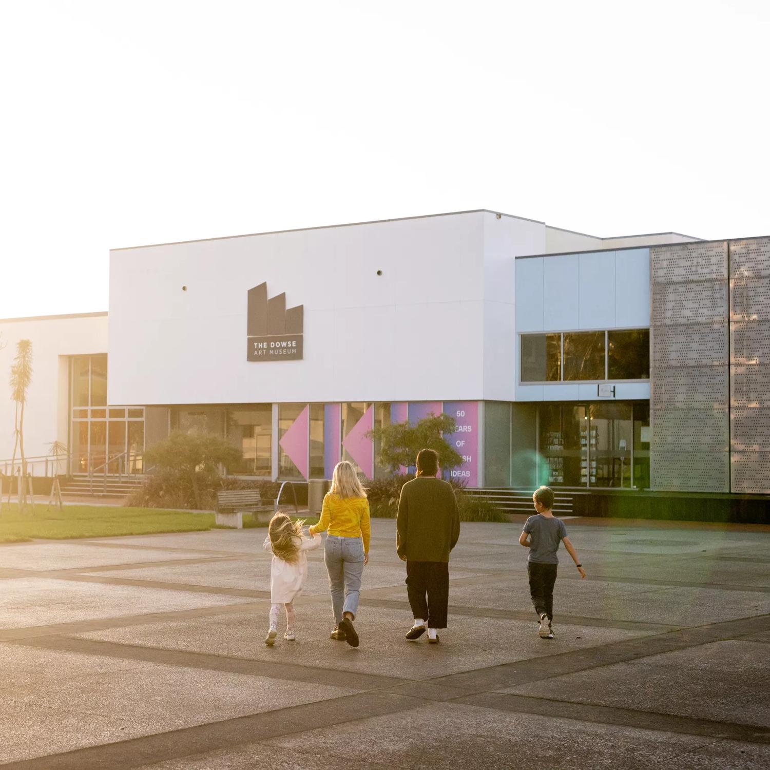 A family walks towards the Dowse Museum in Lower Hutt.