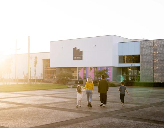 A family walks towards the Dowse Museum in Lower Hutt.