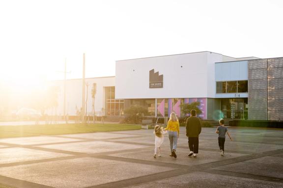 A family walks towards the Dowse Museum in Lower Hutt.