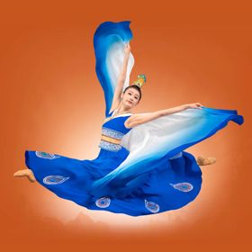A Chinese dancer jumping with arms extended on an orange background.