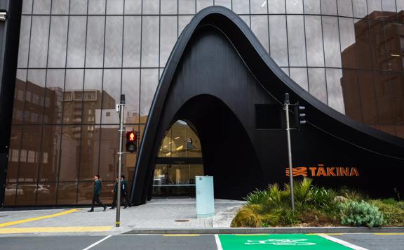 Exterior of the Takina building, Cable Street entrance. There is a pedestrian crossing with traffic lights immediately outside the front entrance.