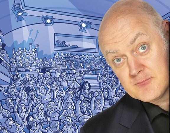 Dara O Briain with a surprised look of his face and a cartoon crown cheering behind.