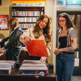 Shoppers browse the vinyl record collection at Octo in Aro Valley.