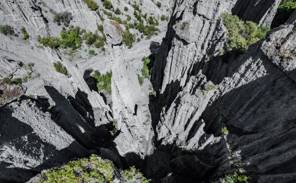 Image of the Pūtangirua Pinnacles. Taken from a drone, looking down on the large stalagmite structures.