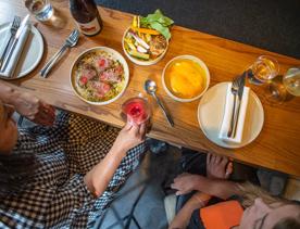 Customers enjoy food and wine at Highwater eatery.
