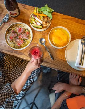 Customers enjoy food and wine at Highwater eatery.