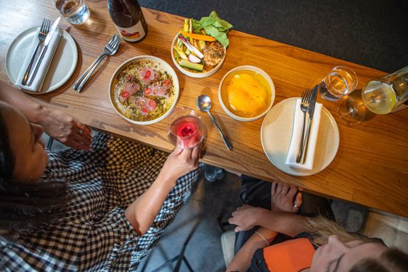 Customers enjoy food and wine at Highwater eatery.