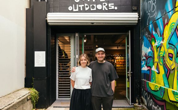 Coffee Outdoors owners Siobhan Oldale and Tom Cappleman standing outside their store in Wellington.